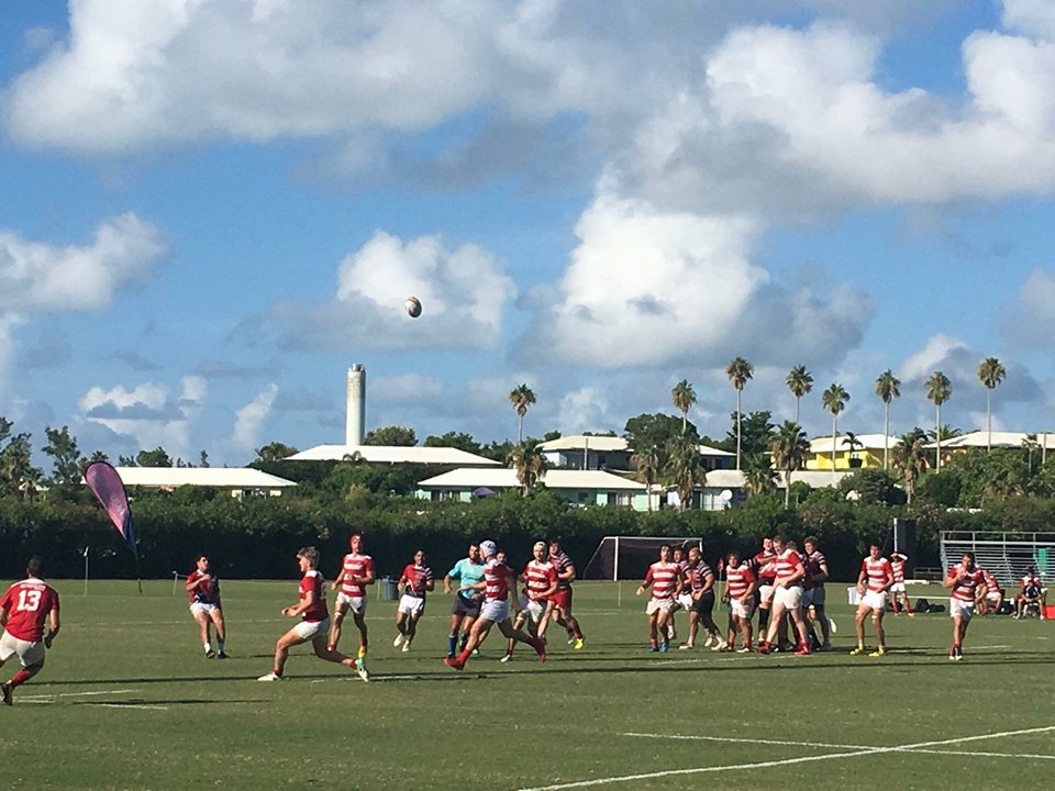 Players enjoying the game of rugby on the field